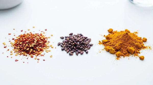 : High-quality macro photography of cayenne, grape seed, and curcumin extracts used in Trackaid.